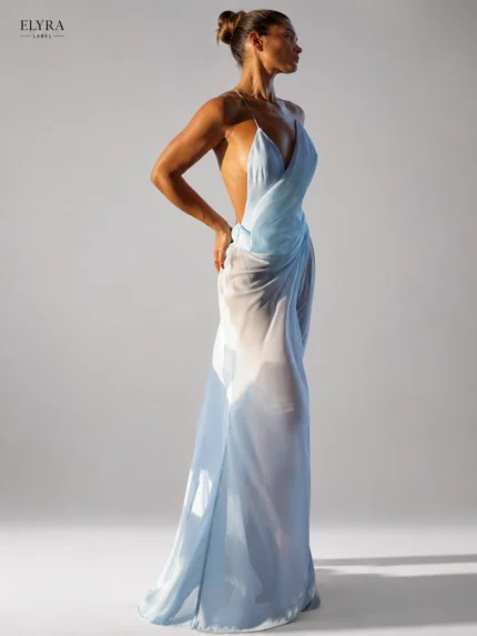 Sky Blue Sheer Slip Maxi Dress by ELYRA LABEL featuring a plunging V-neck, spaghetti straps, open-back design, and flowing sheer maxi silhouette